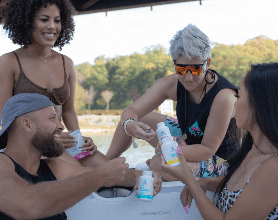People gathered in circle on boat taking delta 8 products