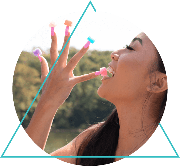 Girl taking delta 8 THC gummy