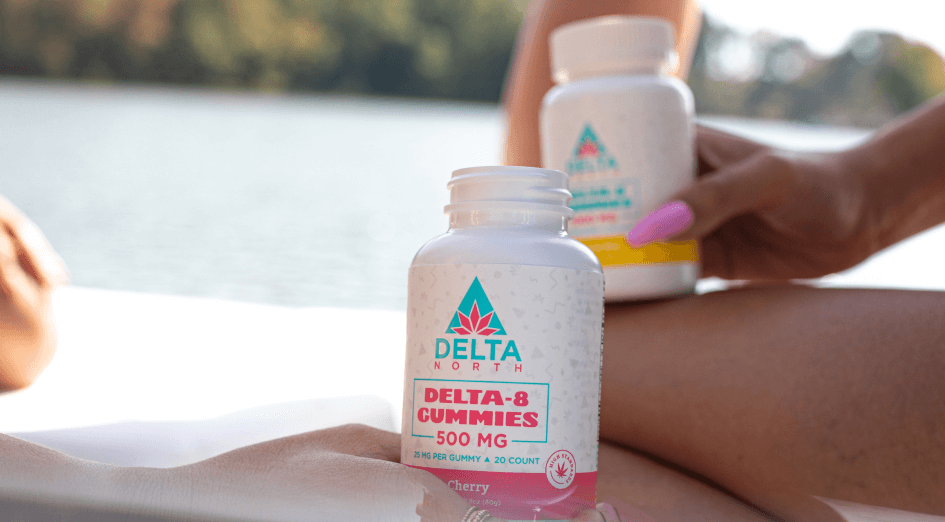 Two delta 8 THC bottles being held close together
